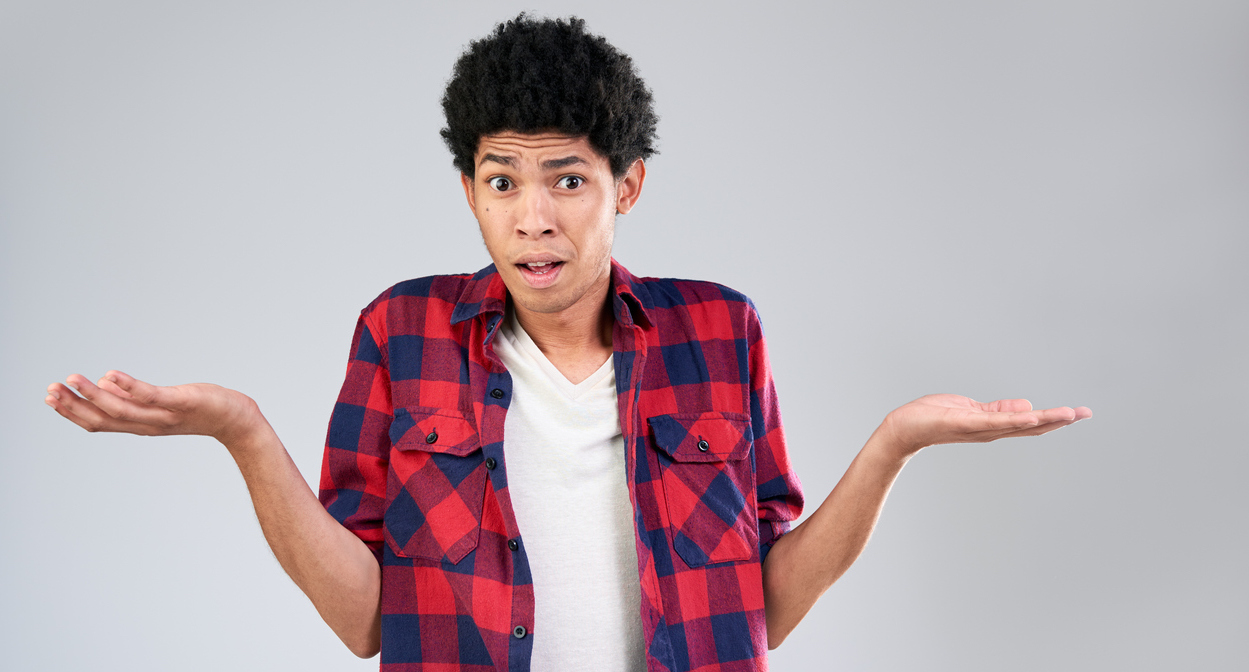What To Do If You Haven't Started College Essays young man of mixed race shrugging shoulders