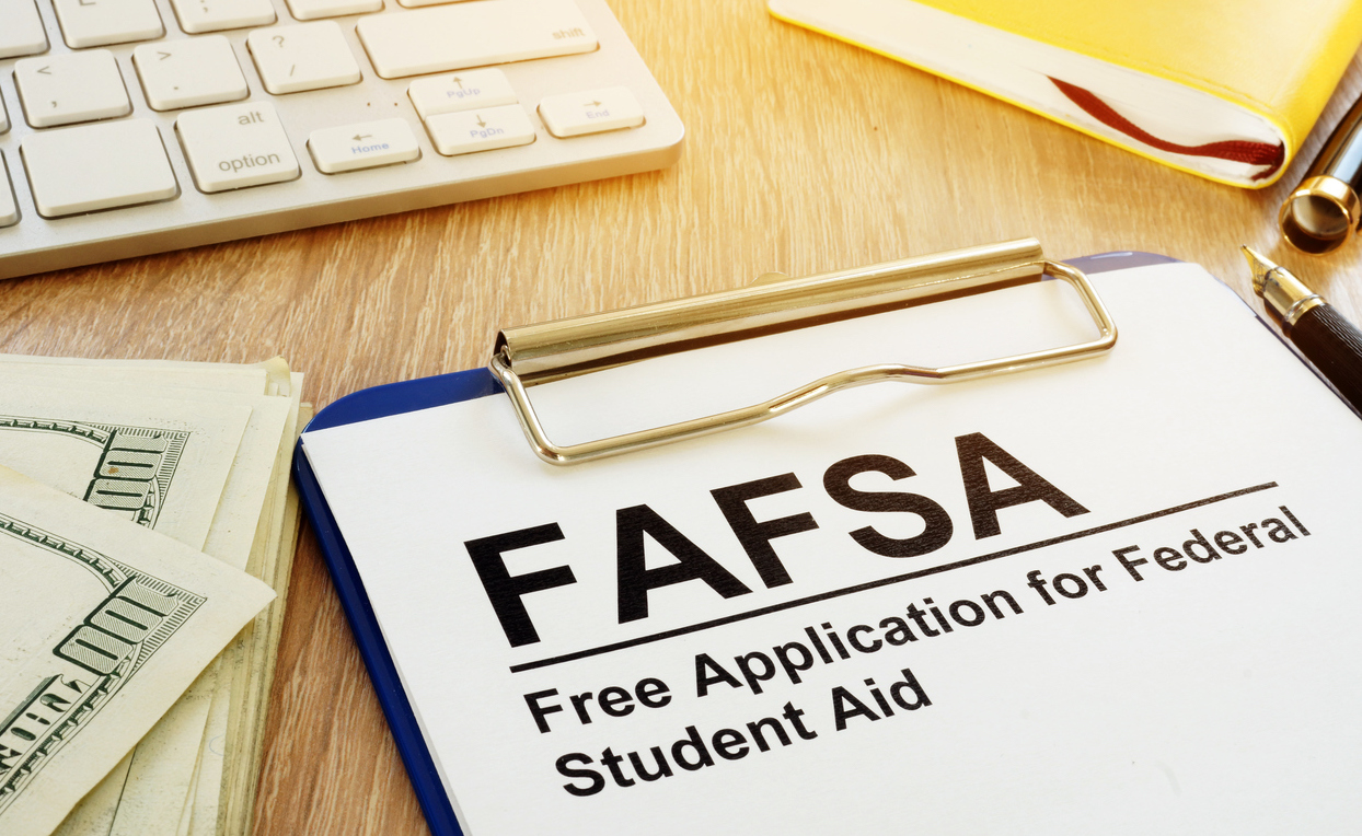 FAFSA Changes May Make Filing Easier FAFSA form on clipboard and keyboard