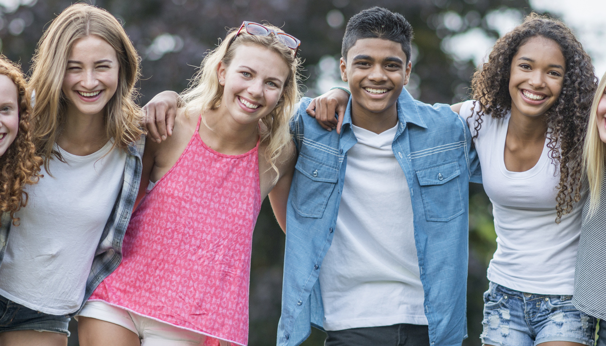 7 Things To Tell Your Teen Before A Summer Program mixed group of teenagers in a circle outside
